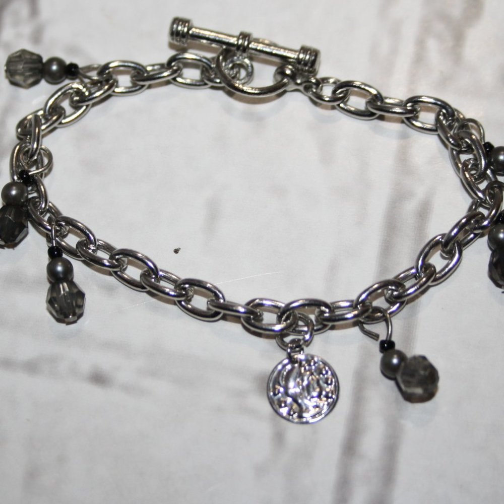 Beautiful silver charm bracelet with coin charm 7.5"
